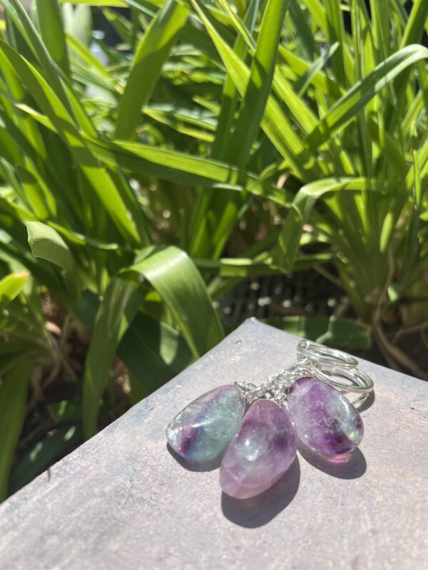 A close up of some earrings on the ground