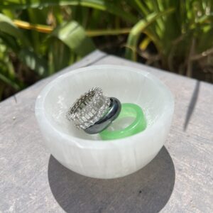 A white bowl with some rings in it