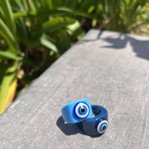 A pair of rings sitting on top of a wooden surface.