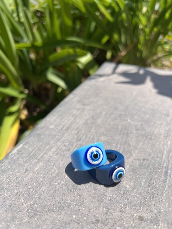 A pair of rings sitting on top of a wooden surface.