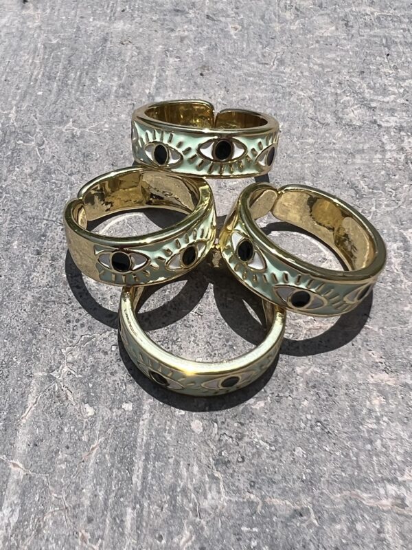 A group of four rings sitting on top of a table.