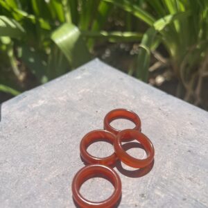 A group of four rings sitting on top of a table.