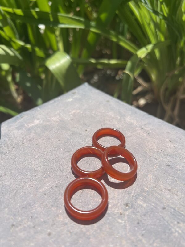 A group of four rings sitting on top of a table.