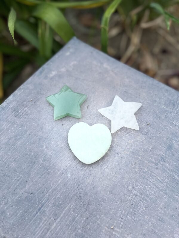 Three stars and a heart on a table.