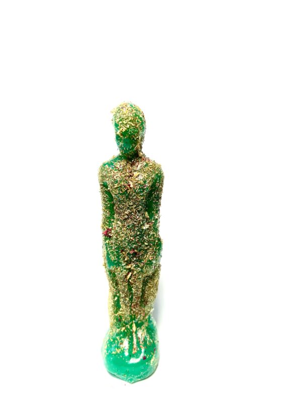 A green statue made of plastic and grass.