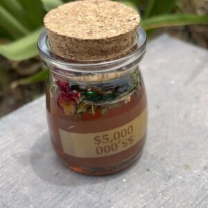 A jar of food with a cork lid on top.