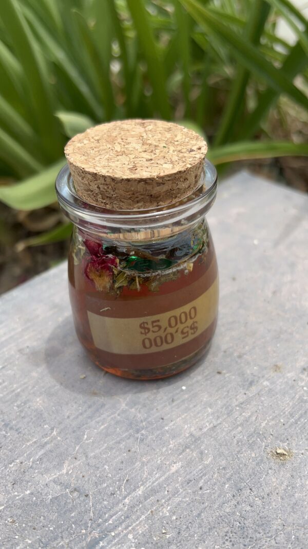 A jar of food with a cork lid on top.