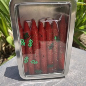 A container of red hot dogs with dollar signs on them.