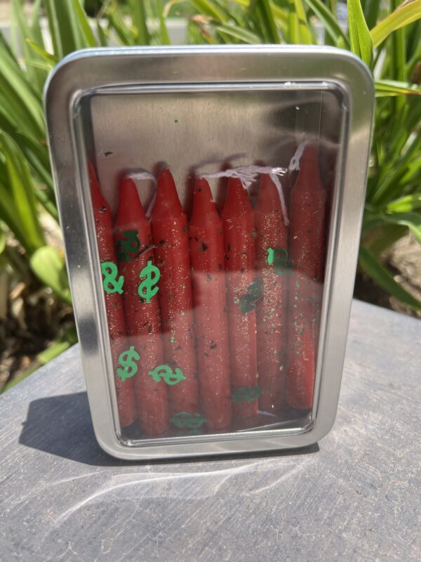 A container of red hot dogs with dollar signs on them.