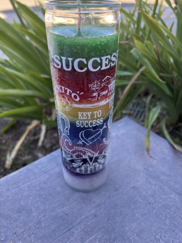 A glass with the word success written on it.