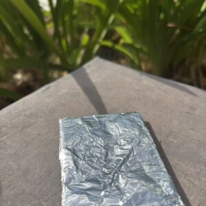 A piece of tin foil sitting on top of a table.