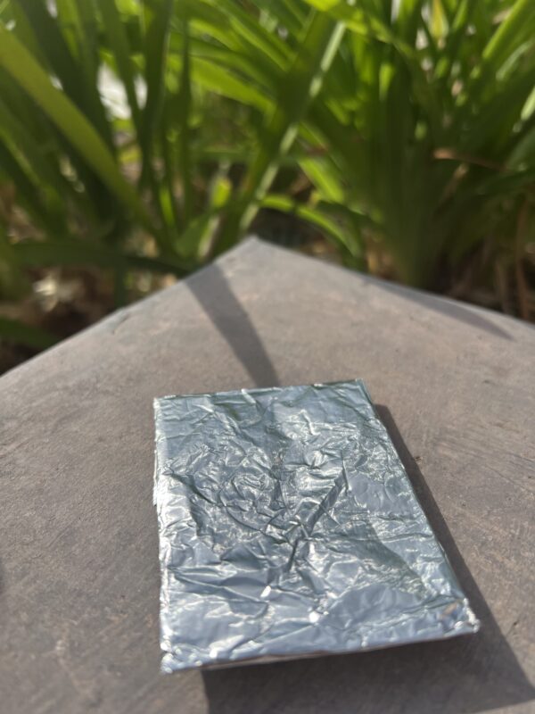 A piece of tin foil sitting on top of a table.