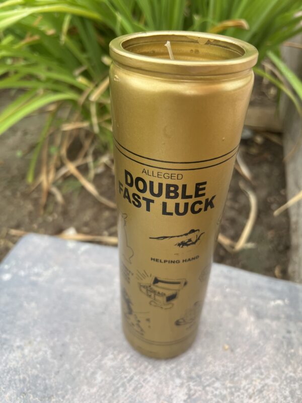 A gold candle that says double fast luck.