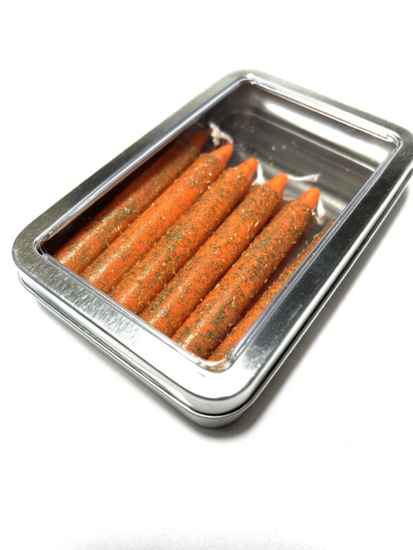 A metal container with carrots in it.