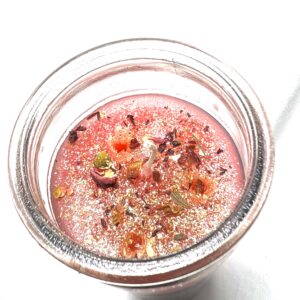 A glass bowl filled with liquid and some food.