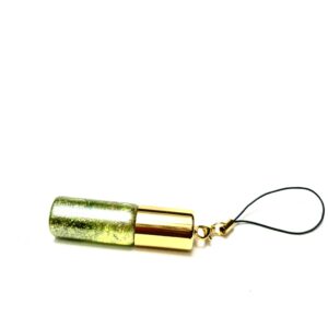 A cell phone charm with a bullet casing.