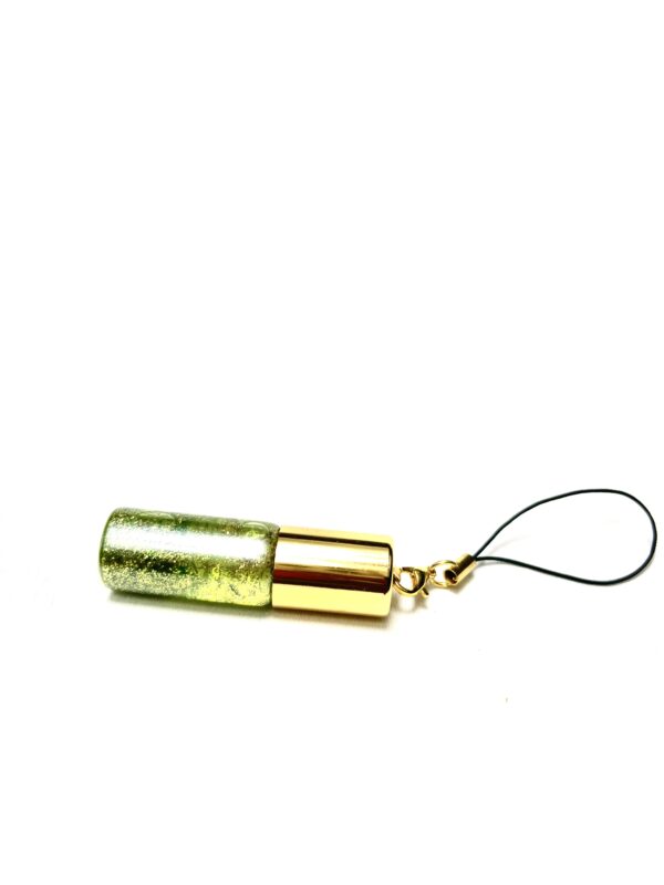 A cell phone charm with a bullet casing.