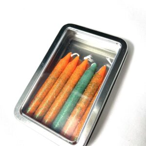 A box of colored pencils in the middle of a table.