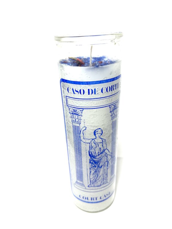 A candle with the image of a man in blue and white.