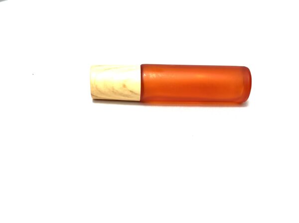 A red tube of lipstick with a wooden top.