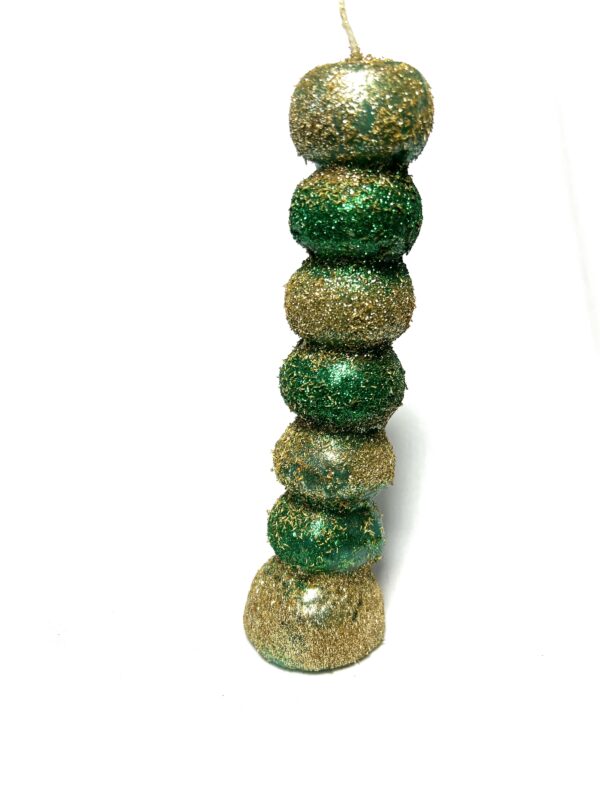 A green and gold bead tower on white background.