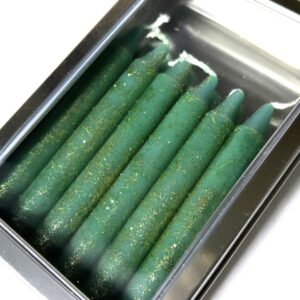 A box of green candles in it