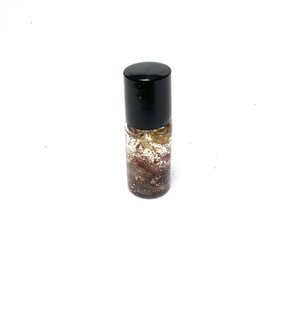 A small bottle of perfume with some flowers on it