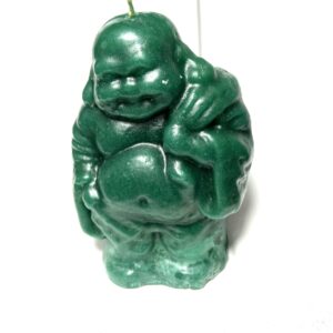 A green candle that is shaped like a buddha.