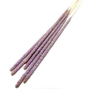 A group of purple sticks with white writing on them.