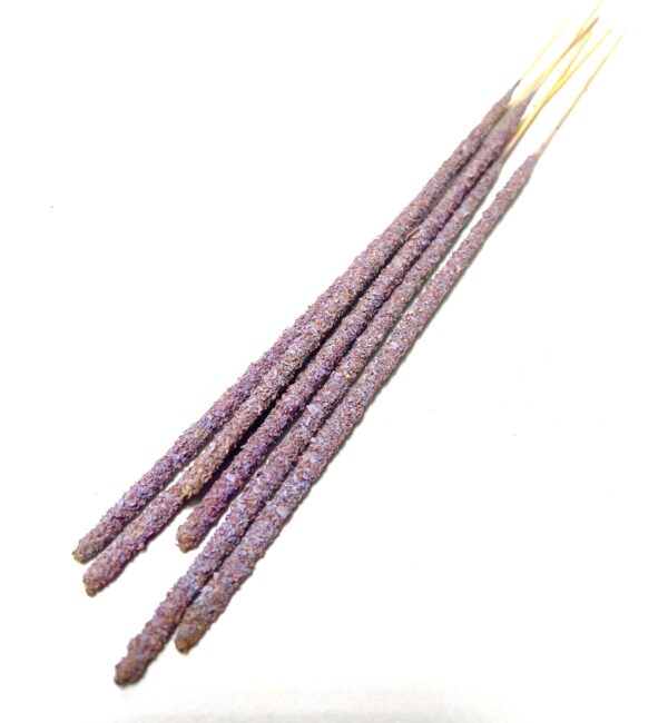 A group of purple sticks with white writing on them.