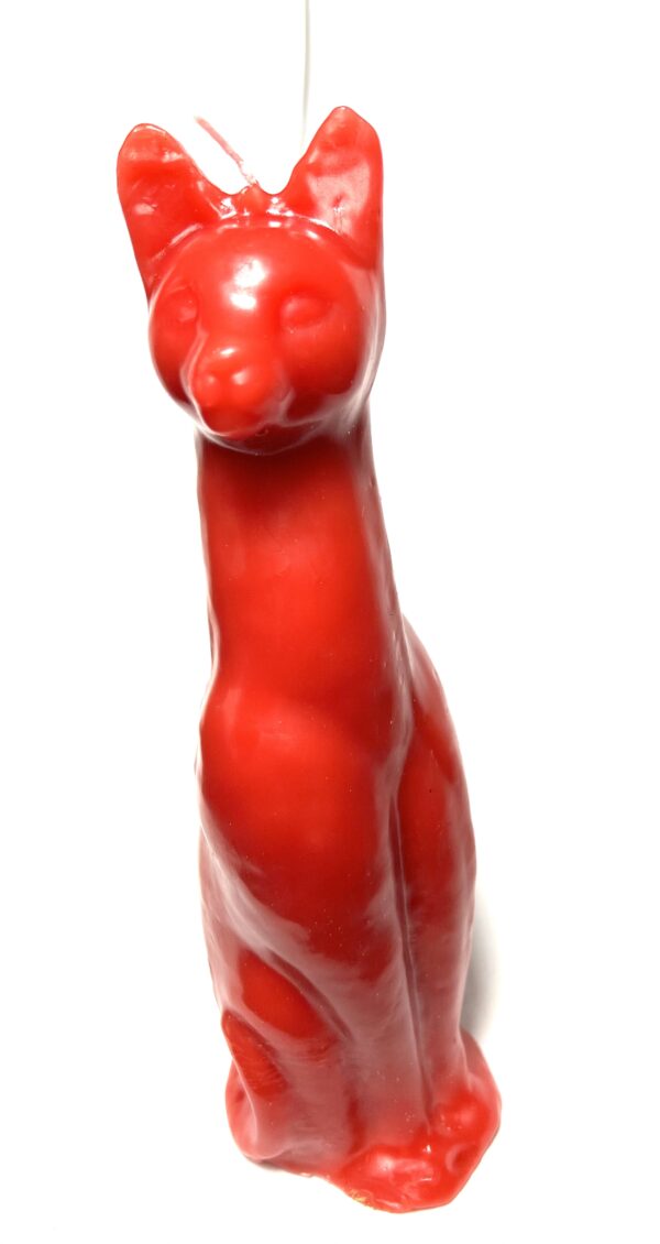 A red cat statue sitting on top of a white floor.