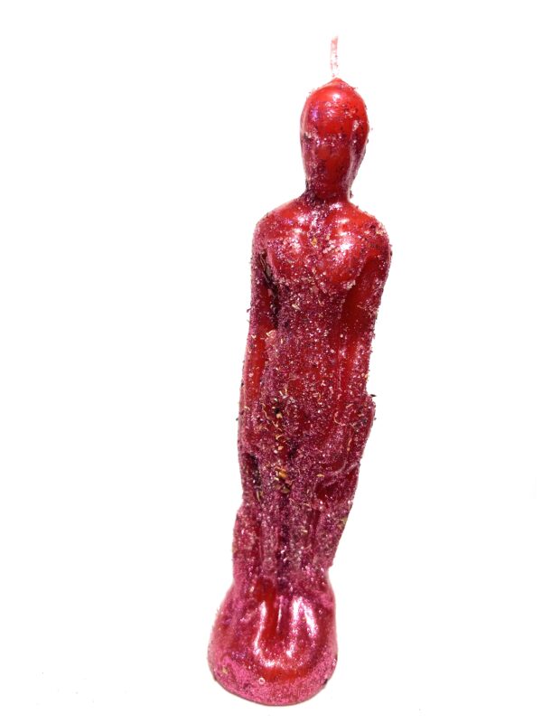 A red statue of a person standing in front of a white wall.