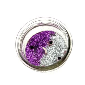 A jar of purple and silver glitter.