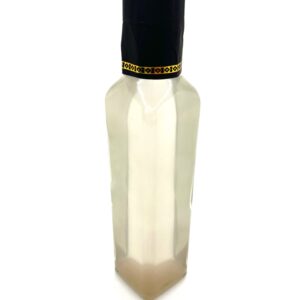 A bottle of lotion with black cap on top.