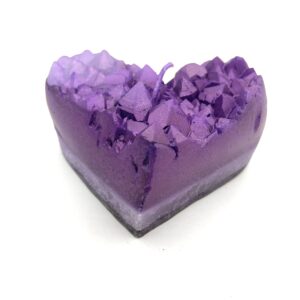 A purple heart shaped soap with lavender petals.