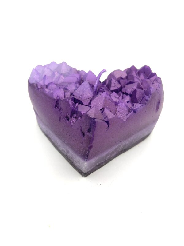 A purple heart shaped soap with lavender petals.