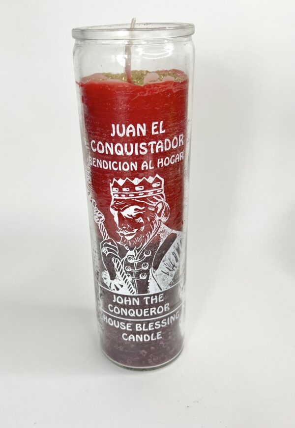 A red candle with the image of juan el conquistador.