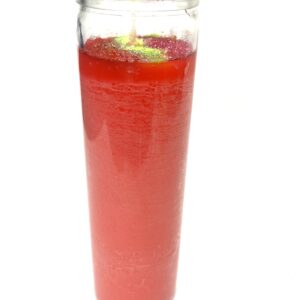 A glass of red liquid with lime on top.