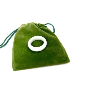 A green bag with a white ring on it.