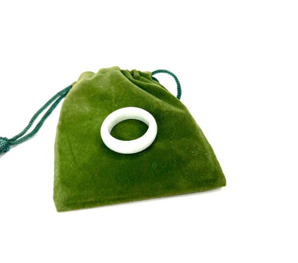 A green bag with a white ring on it.