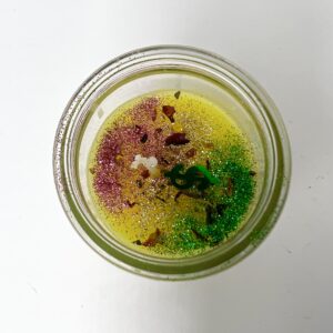 A jar of food with some kind of colorful stuff inside