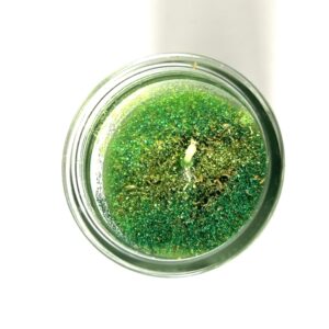 A candle that is sitting in the middle of a table.