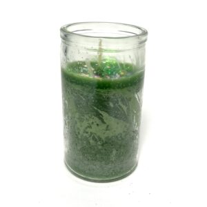 A candle that is sitting in a glass.