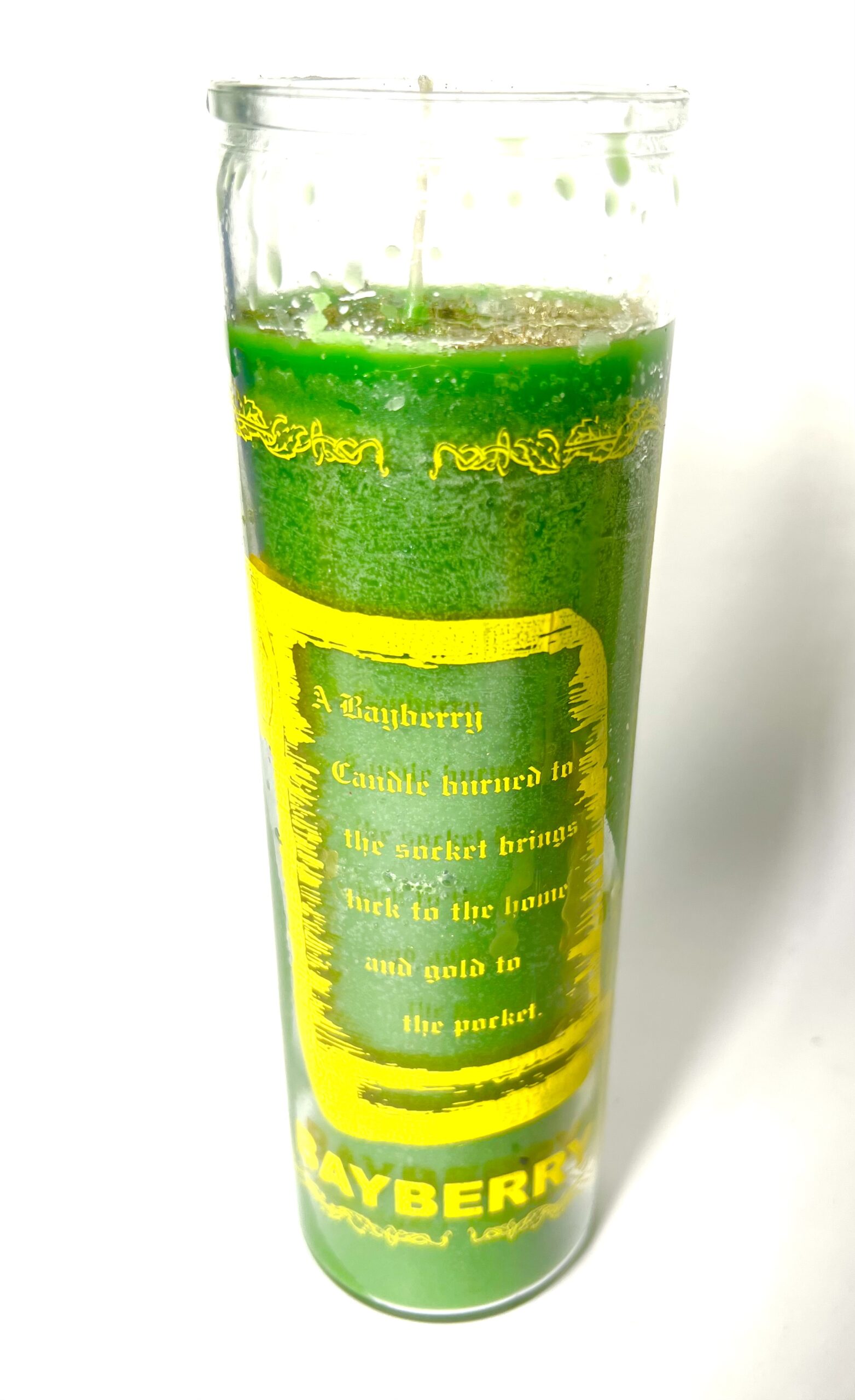 A green candle with the words " prosperity " written on it.