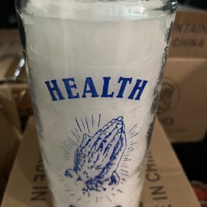 A glass with the word health written on it.