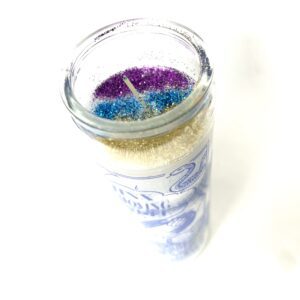 A candle that is sitting on top of a table.