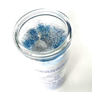 A candle that is sitting in the middle of a table.