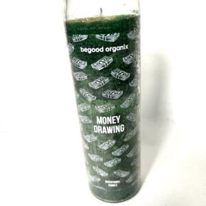 A candle that is sitting on the ground.