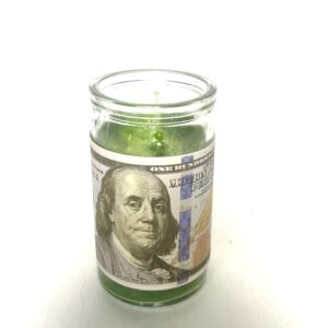 Green candle with Benjamin Franklin on it.