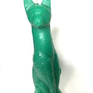 Green cat-shaped candle on white background.